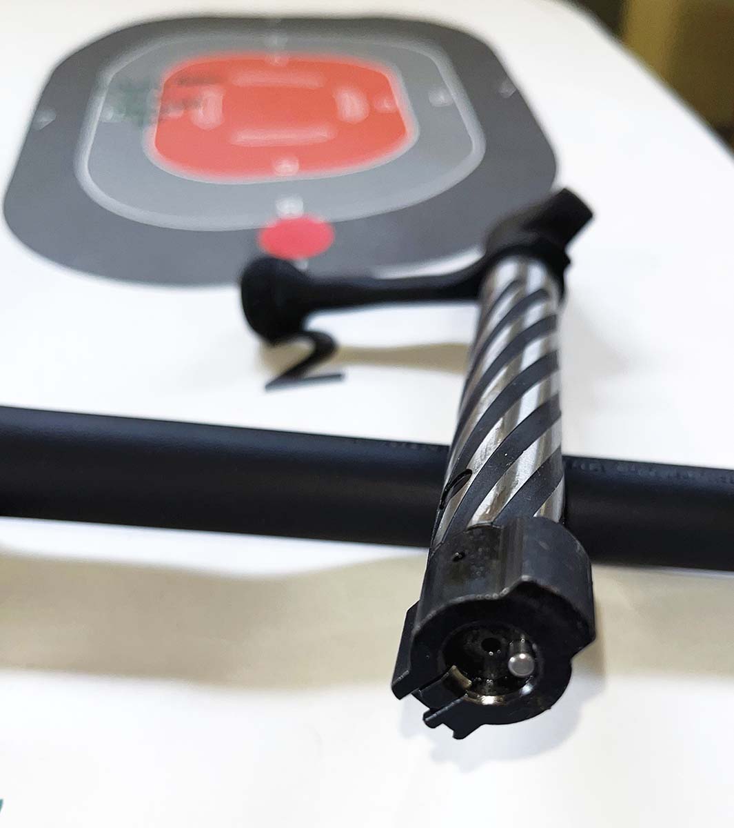 The hardened bolt head holds a small claw extractor on the right-side lug and a plunger ejector at the 5 O’Clock position. Ejection was positive and reliable.